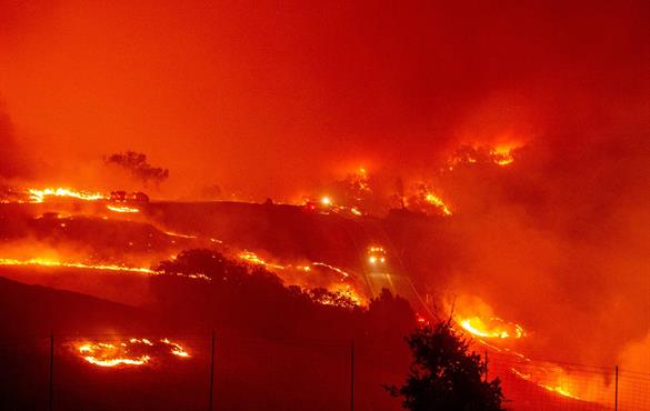 The Kincade fire, burning in Sonoma County near Geyserville, Calif., which burned through 10,000 acres within hours of igniting on Wednesday.Credit...CreditJosh Edelson/Agence France-Presse — Getty Images