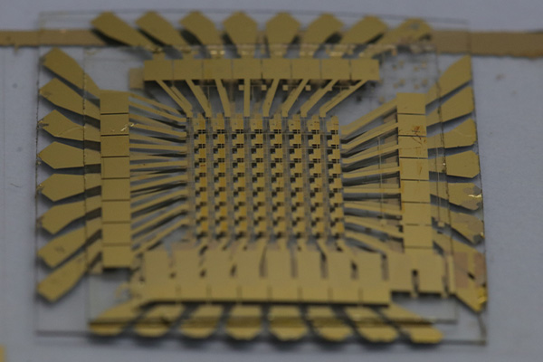 Researchers demonstrated monolithic 3D integration of layered 2D material into novel processing hardware for artificial intelligence computing. The new approach provides a material-level solution for fully integrating many functions into a single, small electronic chip – and paves the way for advanced AI computing. (Photo: Justin Kim, Sang-Hoon Bae Lab/WashU)