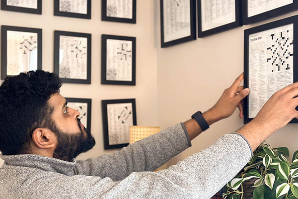 When not conducting research involving the brain, Sid Sivakumar, a MD/PhD student at Washington University in St. Louis, creates crossword puzzles for major newspapers such as The New York Times, The Washington Post, the Los Angeles Times and The Wall Street Journal. Sivakumar collects images of his Sunday crosswords and displays the puzzles on walls in his apartment near the Medical Campus. (Credit: Katie Gertler)