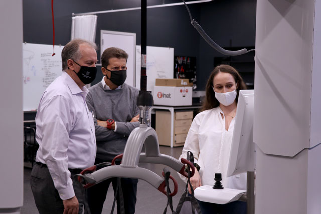 Franziska Kirstein, right, presents the Patient Transfer Rehabilitation Robot to Bruno Sinopoli, department chair and Das Family Distinguished Professor, and Aaron Bobick, dean and James M. McKelvey Professor.